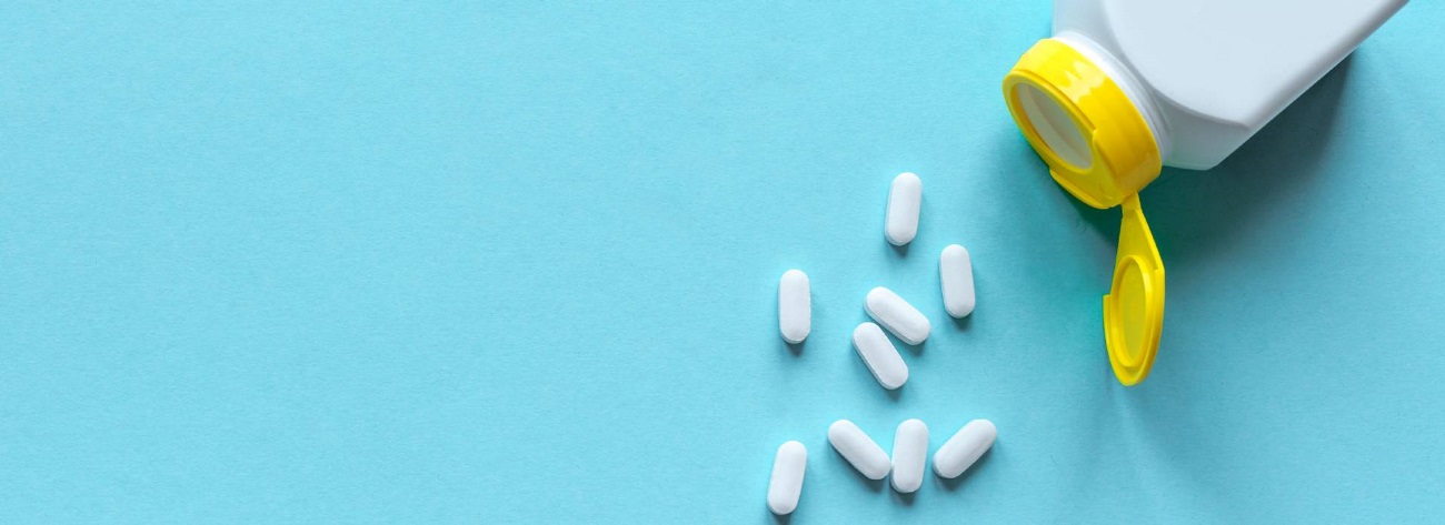 pill bottle with pills pouring out